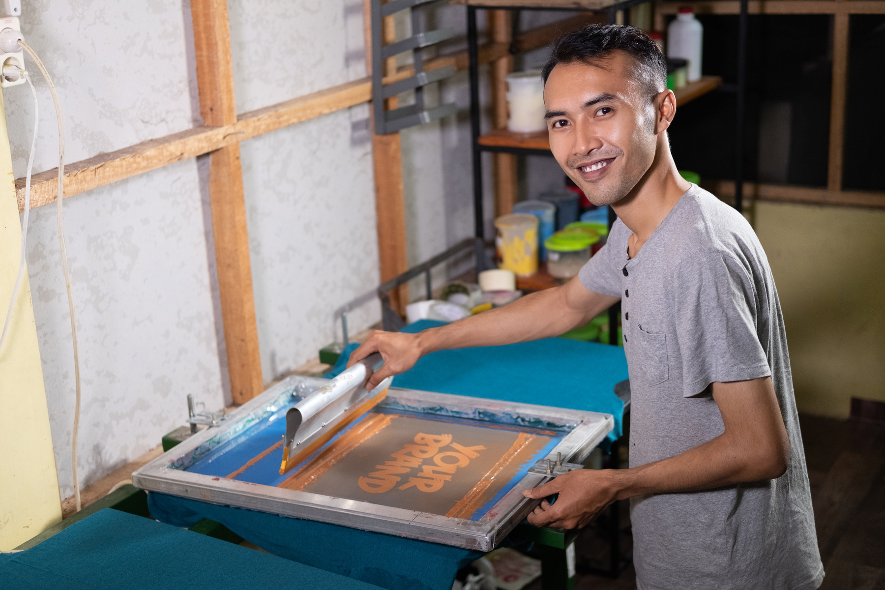 Silk Screen Printing and Wooden Frame Using the Screen Printing Squeegee to Print T-Shirts